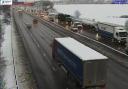 Heavy traffic can be seen on one carriageway of the M25 near Potters Bar.