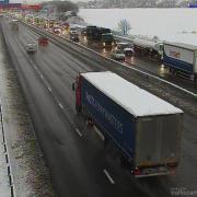 Heavy traffic can be seen on one carriageway of the M25 near Potters Bar.