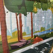 Steve Ellis's mural behind the play area at Croydon Reading Room