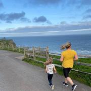 Emma Tooley running with her daughter