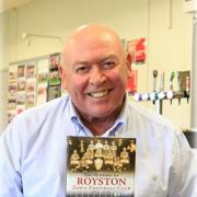 Alan Barlow with his book of Royston Town FC. Picture: RTFC