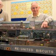 Mike Bash and Roger Baker display their fictional part of North England, 'Re-United Biscuits'