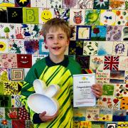Freddie Jacklin with his prize from Glazed Creations