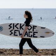 People take part in a protest by Surfers Against Sewage in Falmouth (Anthony Upton/PA Media Assignments)
