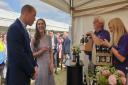 The Duke and Duchess of Cambridge receive a selection of drinks from a Cambridgeshire supplier at Cambridgeshire County Day 2022 in Newmarket