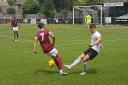 New Royston signing Jay Rolfe battles with Quentin Monville of Potters Bar Town.