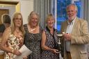 Kath Caunce and Keith Taylor were presented with the Johnson Matthey Mixed Draw Cup by ladies' captain Tracey Parsons (second from left) and organiser Sandy Griffiths (left).