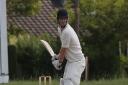 Ed Wharton performed with bat and ball to guide Reed to a draw with Harpenden.