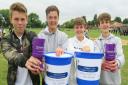 Students holding charity collection buckets at Bassingbourn Village College fete.
