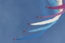 The Red Arrows display team and their iconic colourful vapour trail at a previous Duxford Summer Air Show.