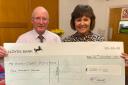 David Powell from Royston Bowling Club presenting the cheque to Tracy Aggett from Home-Start