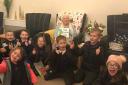 Enid celebrating her 101st birthday with children from Barley and Barkway First Schools