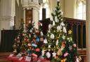 Mordens Scout Group decorated trees for the Christmas tree festival at St Peter and St Paul in Steeple Morden