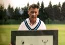 Fred Standen with the signed print of ex-England wicket keeper Jack Russell.