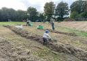 Volunteers helped rake up the grass on Sun Hill Common