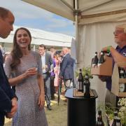 The Duke and Duchess of Cambridge receive a selection of drinks from a Cambridgeshire supplier at Cambridgeshire County Day 2022 in Newmarket