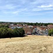 Parched grass atop Windmill Hill in Hitchin, Hertfordshire on Saturday, August 6