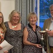 Kath Caunce and Keith Taylor were presented with the Johnson Matthey Mixed Draw Cup by ladies' captain Tracey Parsons (second from left) and organiser Sandy Griffiths (left).