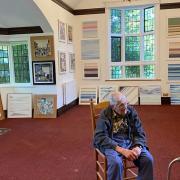 Former Meridian headteacher Peter Stone with his art at Maycroft care home.