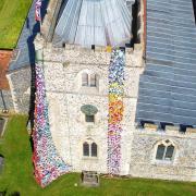A drone shot of the amazing Barley Flower Tower at St Margaret of Antioch Church.