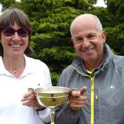 The Hallmark Trophy is presented to winner Martin Redgewell by ladies' captain Deborah Bryan.
