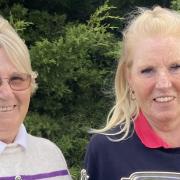 Gay Rodham and Debby Tweddle with their winners\' trophies at Heydon Grange Golf Club.