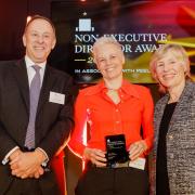 Barbara Anderson accepting her recent non-executive director award from Simon Gorringe, head of Santander, and Ruth Cairnie, chair of the NED Awards