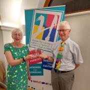 Jane and Mike Dottridge, from Royston & District Twinning Association, receiving a trophy for 'twin town of the year'