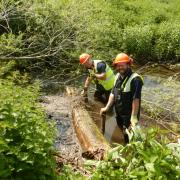 Council operatives Lee Haywood and Wes Thurley helping to restore the River Mel