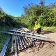 South Cambridgeshire District Council enforcement officer Ben Wilkin examines a fly-tipping incident