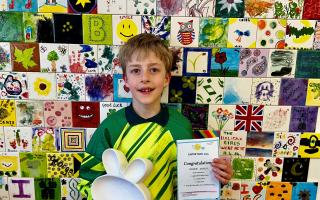Freddie Jacklin with his prize from Glazed Creations